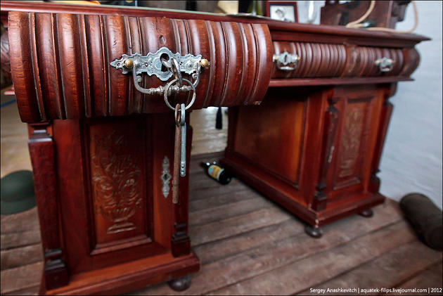 A large oak desk in the General's bunker