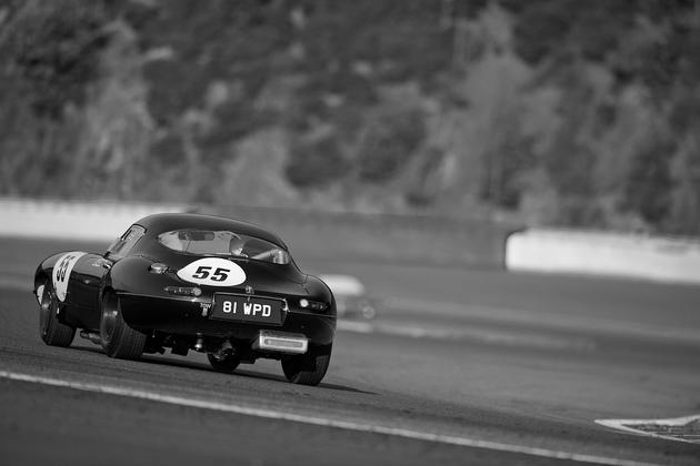 Black Jaguar E-type flying down the track