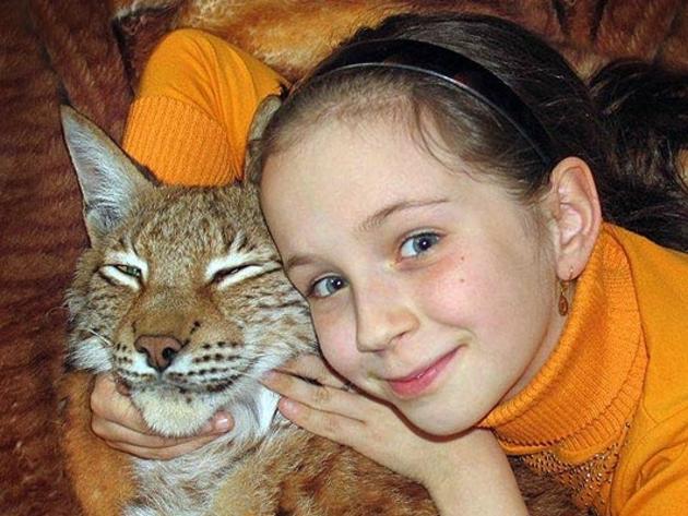 Girl and her lynx are best friends