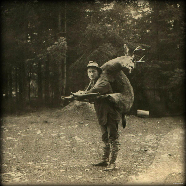 Old Weird Photos carrying a deer