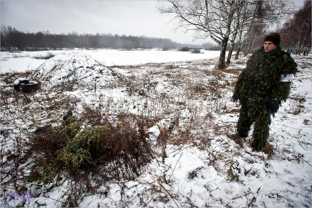 snipers camouflaged in grass