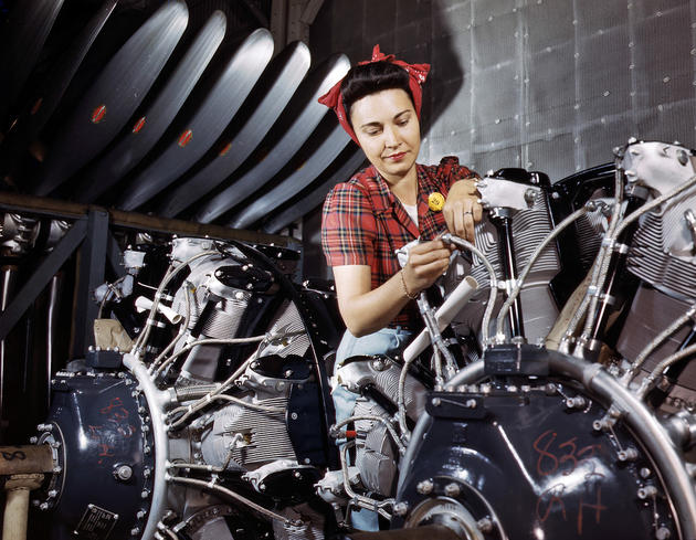 An engine inspector checks over B-25 engines