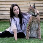Pet Lynx beside one of the family members in Kaluga, Russia