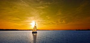 A sunset over a sail boat HD Wallpaper