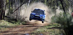 Subaru STi catching air Rally Wallpaper