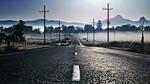 A foggy road in the morning HD Wallpaper