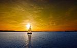 A sunset over a sail boat HD Wallpaper